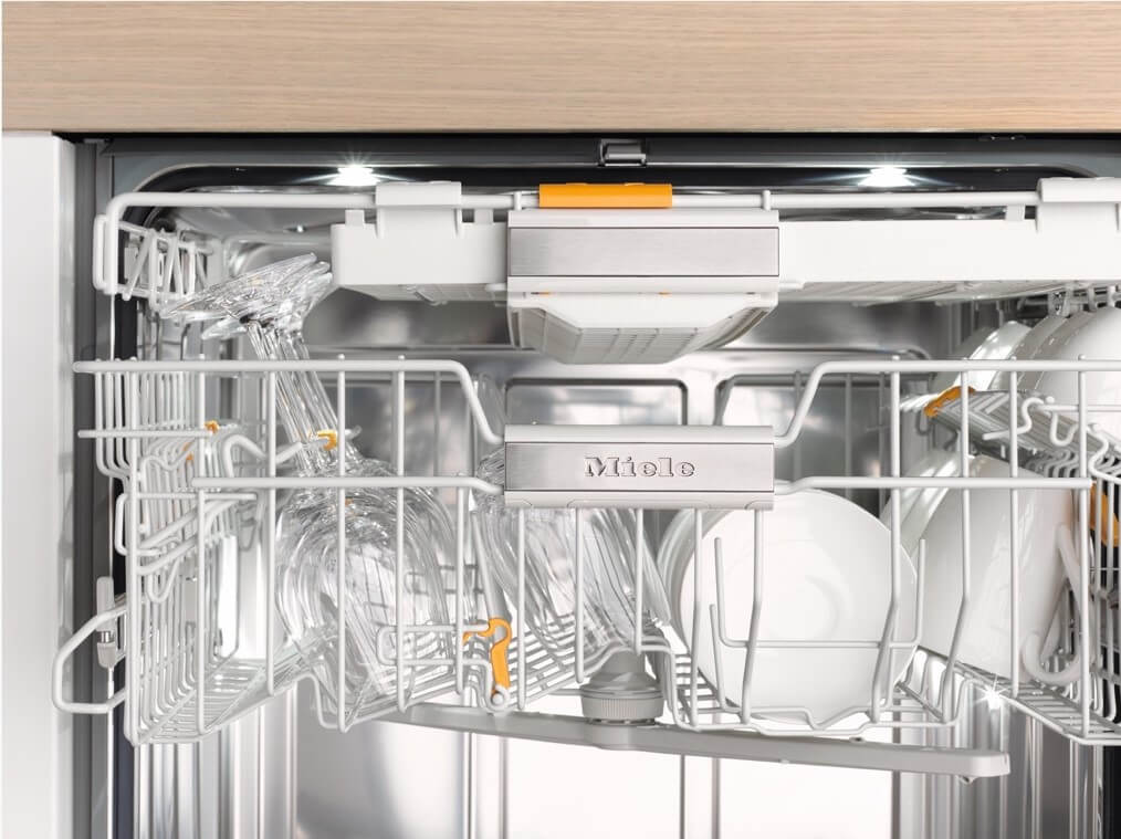 Dishes and glassware stacked in Miele dishwasher
