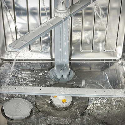 Inside a Miele dishwasher. Its advanced water supply system reduces both energy and water consumption.