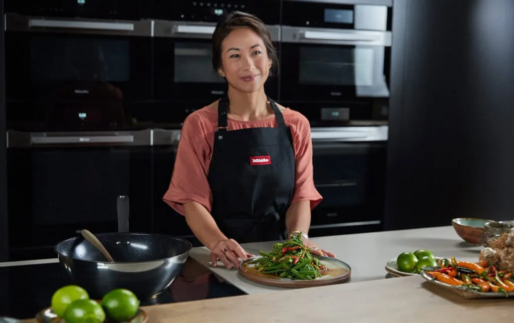 Palisa preparing the ingredients for her dish using Miele induction and steam appliances
